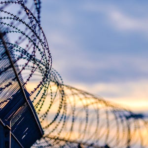 Barbed wire at sunset