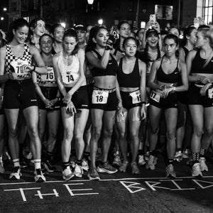 women line up for a night street race in NYC