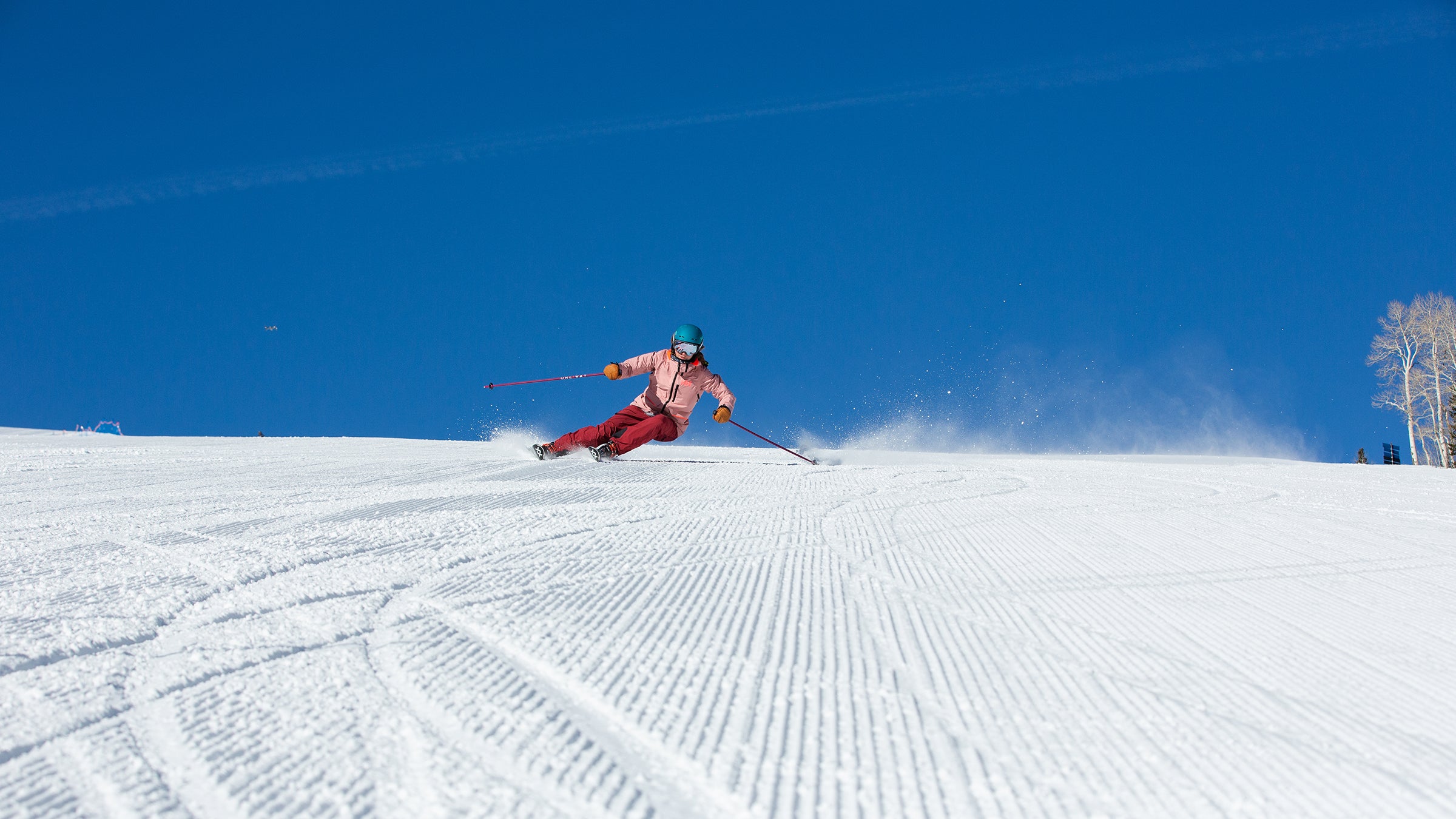 Ski tester arcing a pair of carving skis