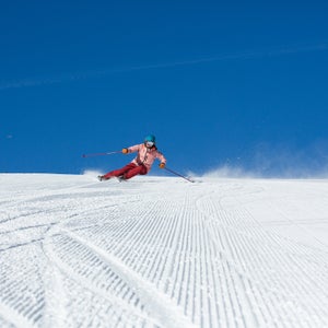 Ski tester arcing a pair of carving skis