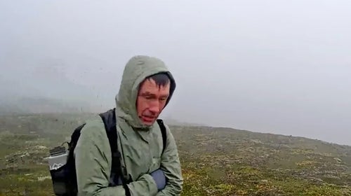 A lost hiker looks in a bear camera