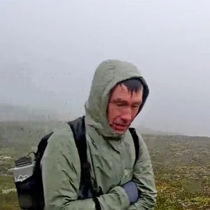 A lost hiker looks in a bear camera
