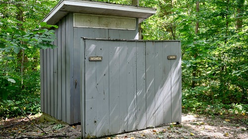 A pristine outdoor toilet serves as a reminder to never try to save something from inside the vault.