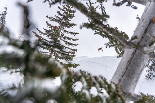 Man doing an air on a snowboard