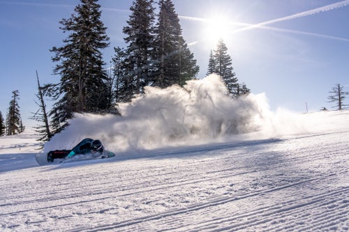 Man snowboarding on a groomer