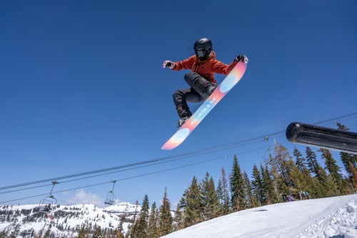 Woman jibs on a snowboard