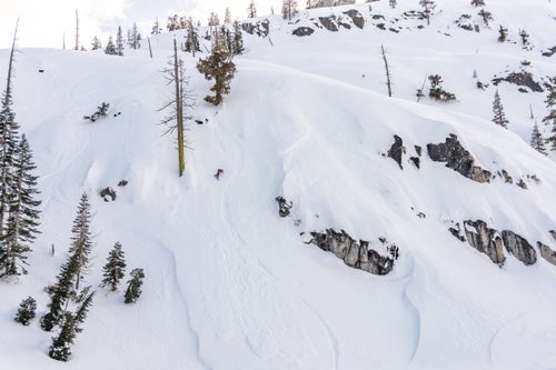 Woman snowboarding on a powdery landscape