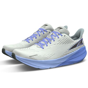 A white and purple pair of running shoes