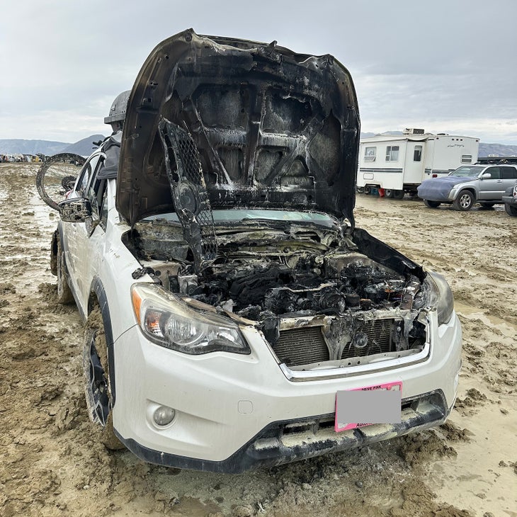 A car that burst into flames while trying to drive out in the mud. Neighbors were able to put it out with fire extinguishers.
