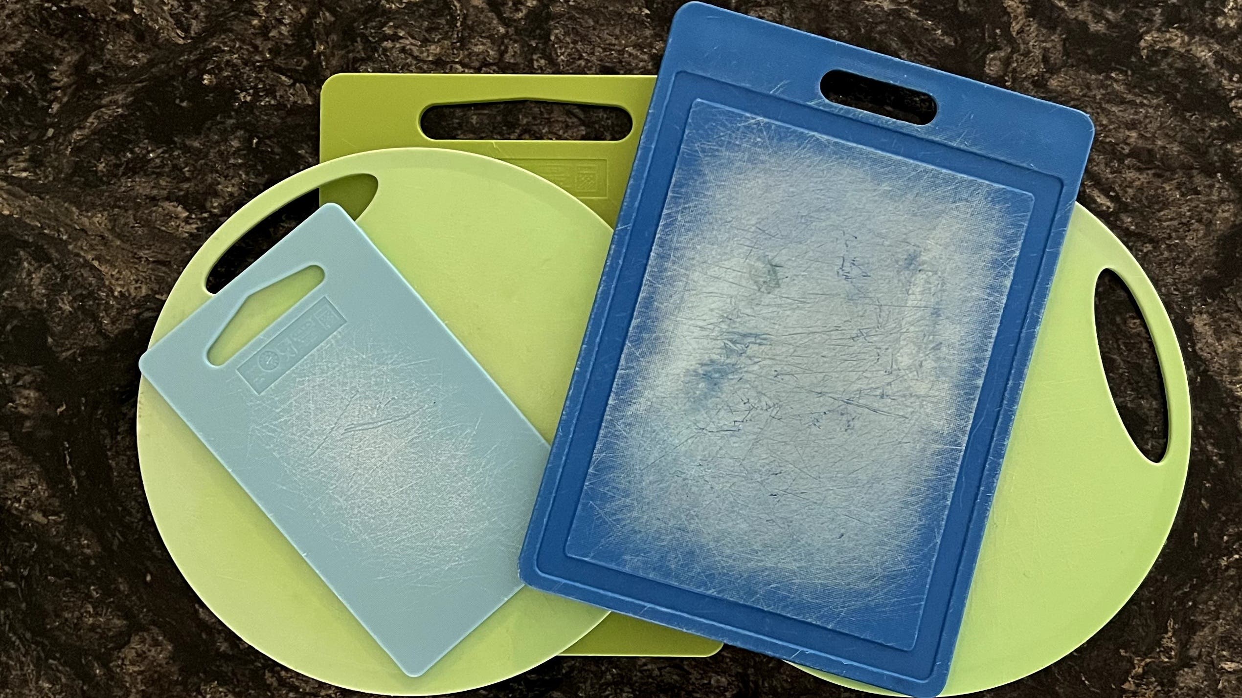 An array of well-worn plastic cutting boards that are no longer safe to use because of microplastics