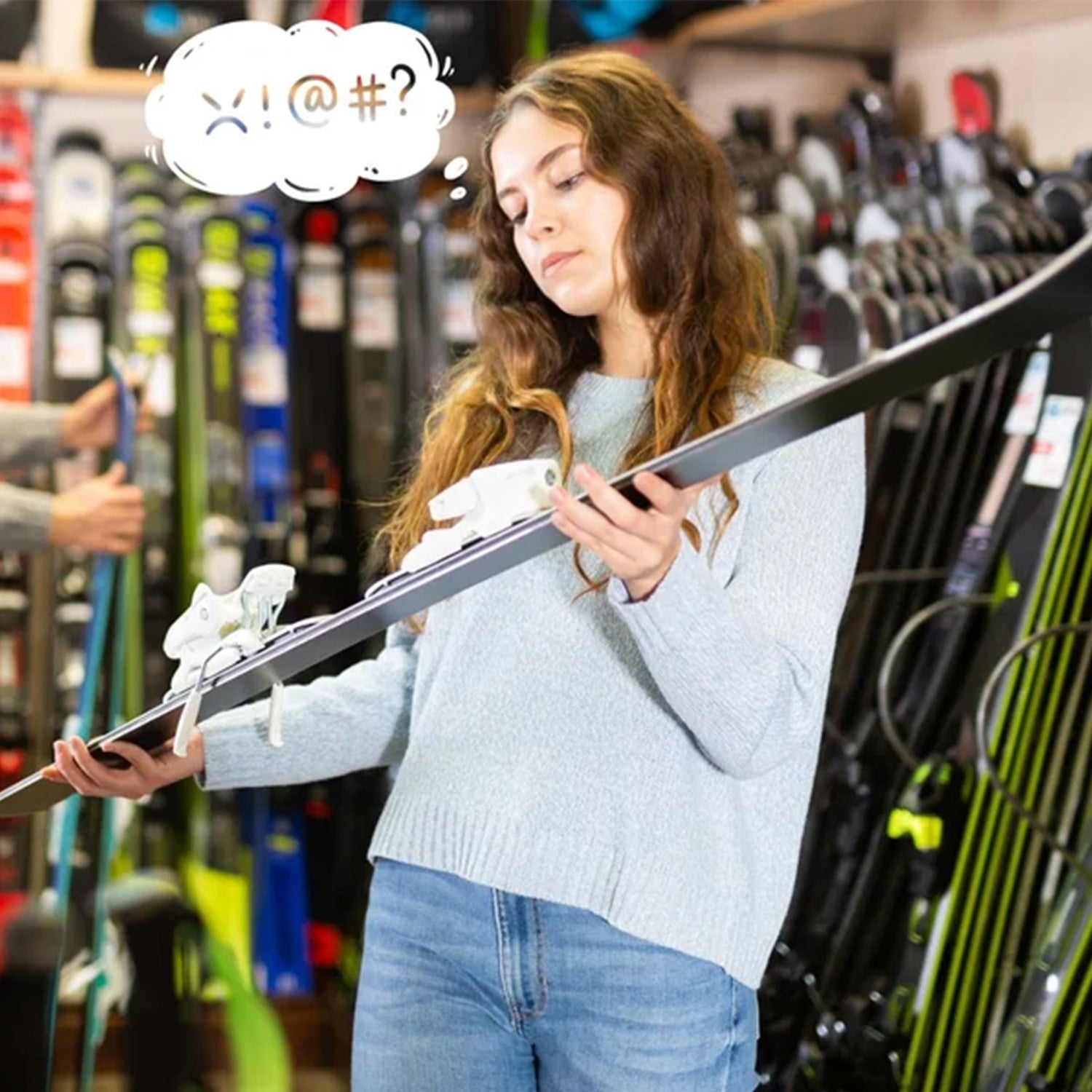 A woman ponders ski construction in a ski shop