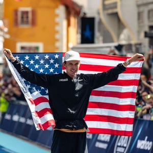 walmsley holds up american flag after winning UTMB