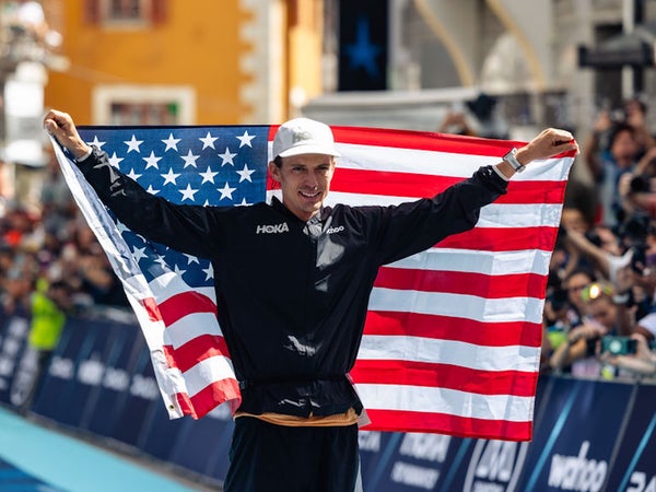 walmsley holds up american flag after winning UTMB