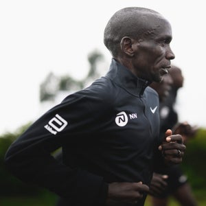 A man runs in a black jacket