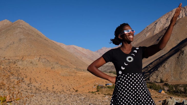 The author, wearing special eyewear and a shirt with images of the moon phases on it, to view the 2017 total eclipse in Chile