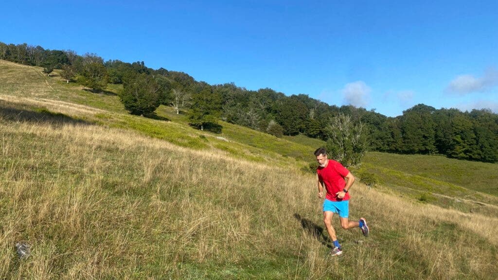 The author trail-running across a slope of the property
