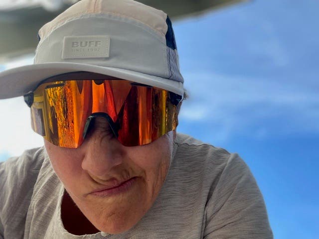 Lisa Jhung wearing hear wraparound sunglasses