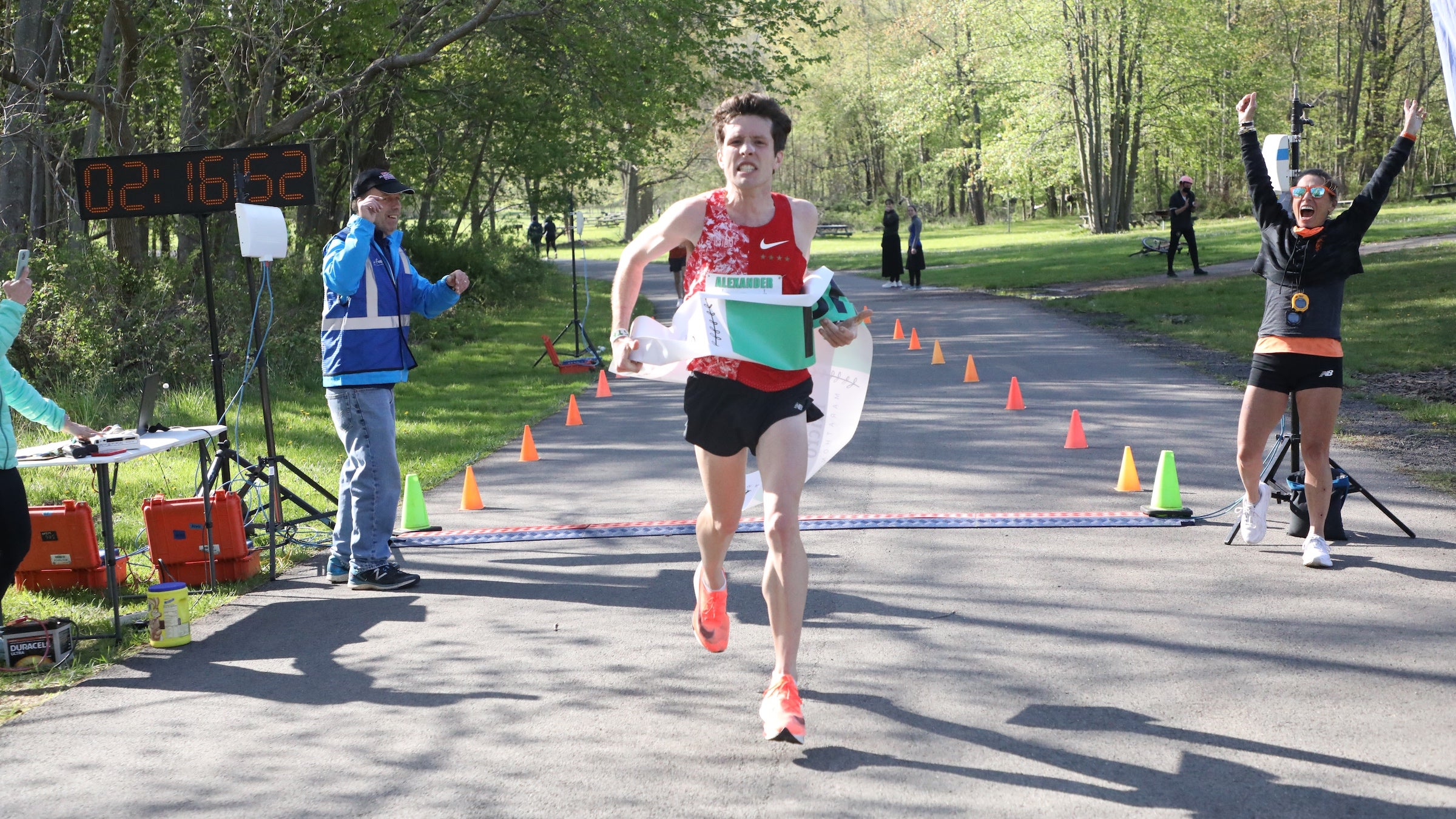A man in a red shirt wins a marathon