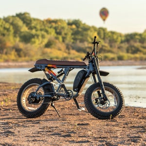 adventure e-bike beside a river