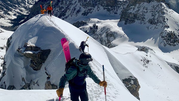 Backcountry skiers on a mountain ridge