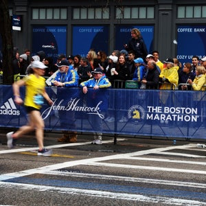 Two runners near the finish line of the Boston Marathon