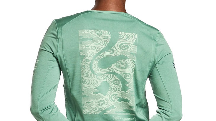 A pattern on back of a green long sleeve shirt