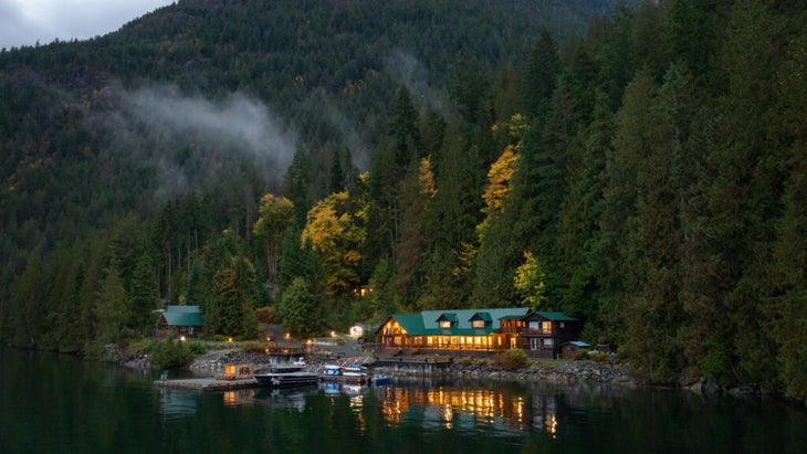 Fall begins to color the trees on the hill behind the Klahoose Wilderness Resort in British Columbia. The property was renovated in 2023.