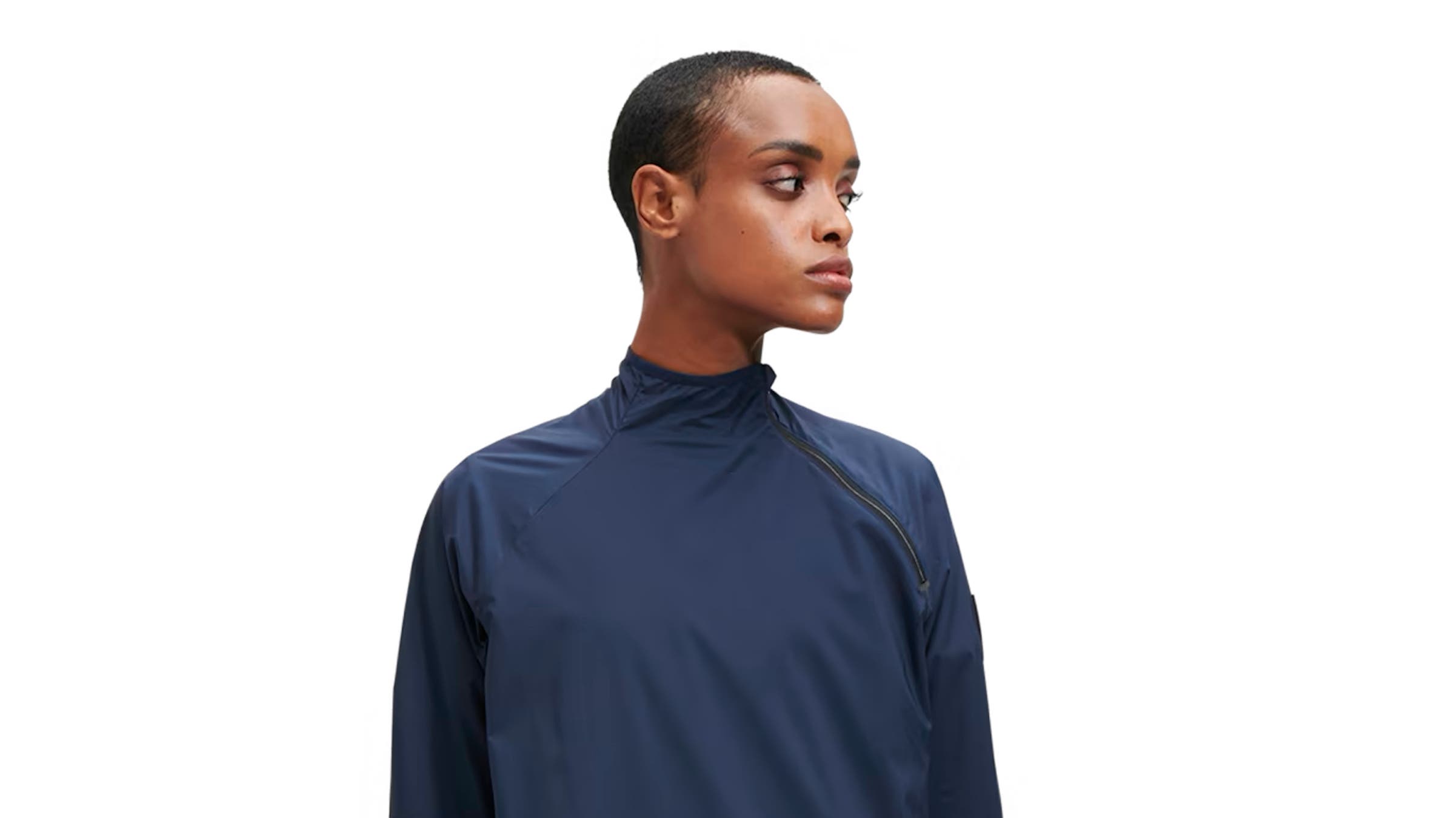 A woman wears a navy blue jacket