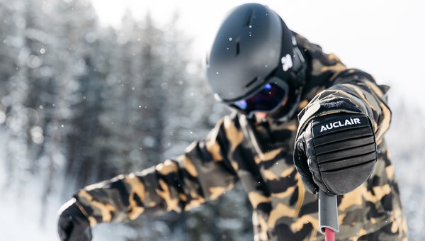 Close up of gloves on a ski tester