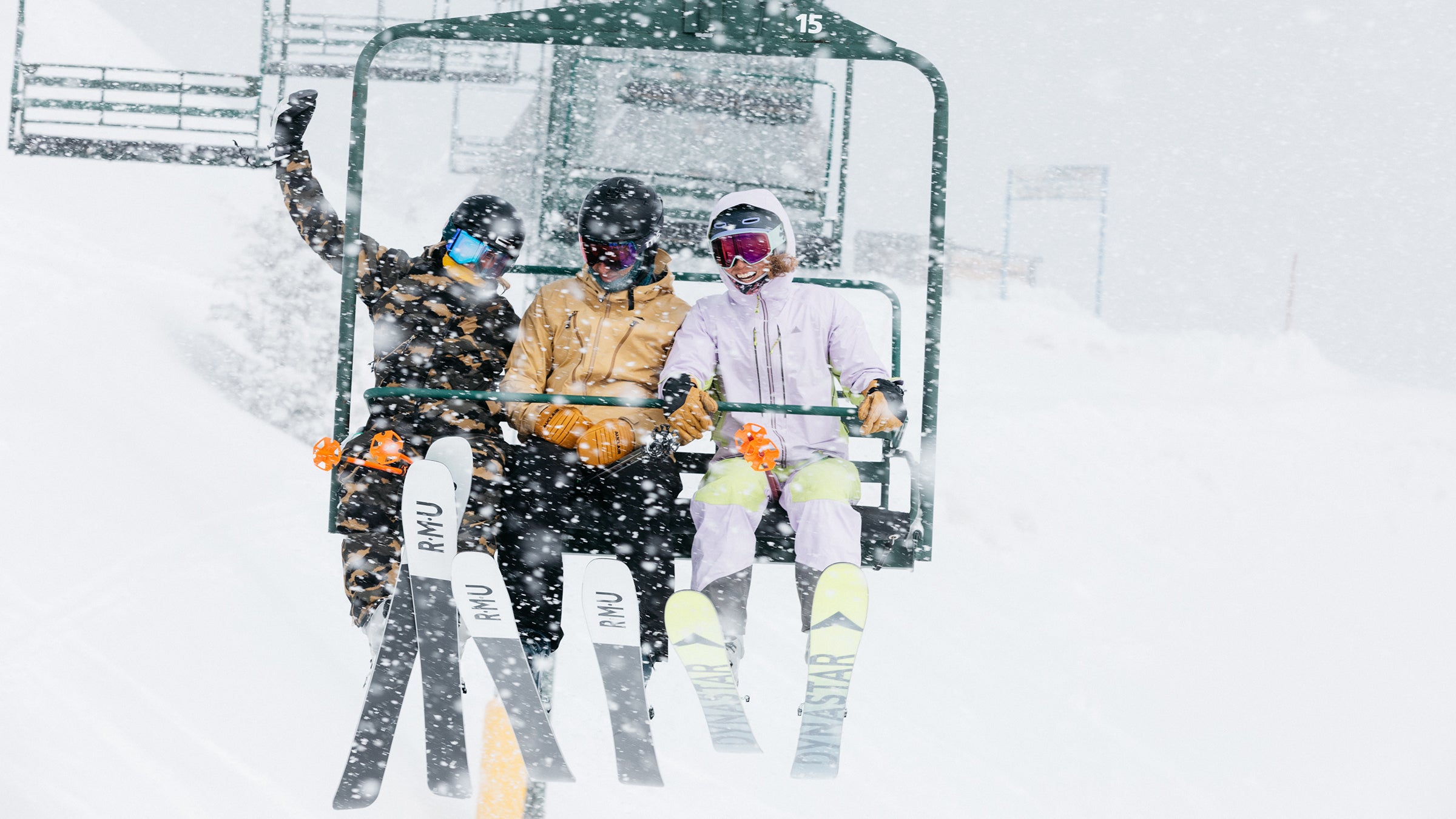 Women wearing jackets on a chairlift during the ski test