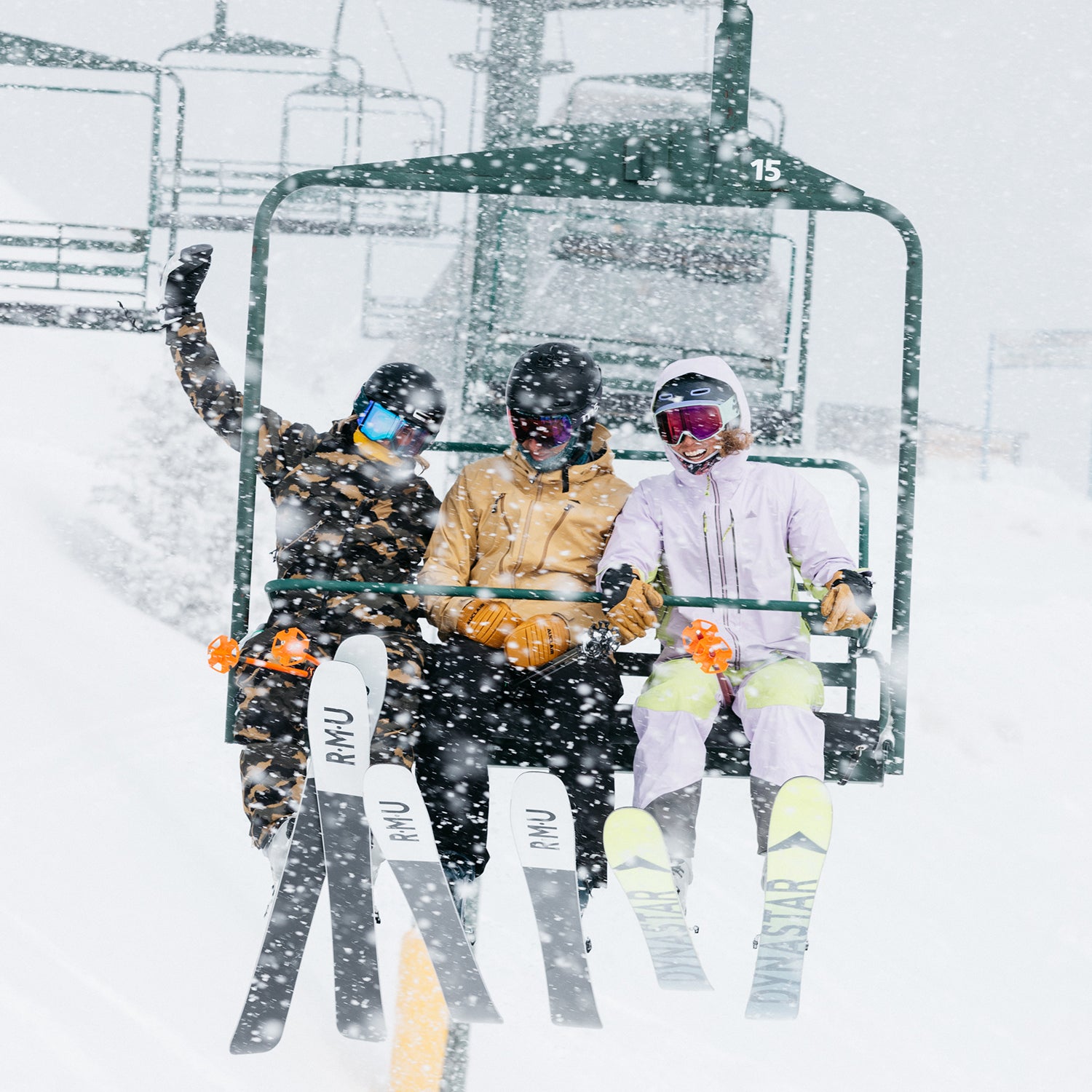 Women wearing jackets on a chairlift during the ski test