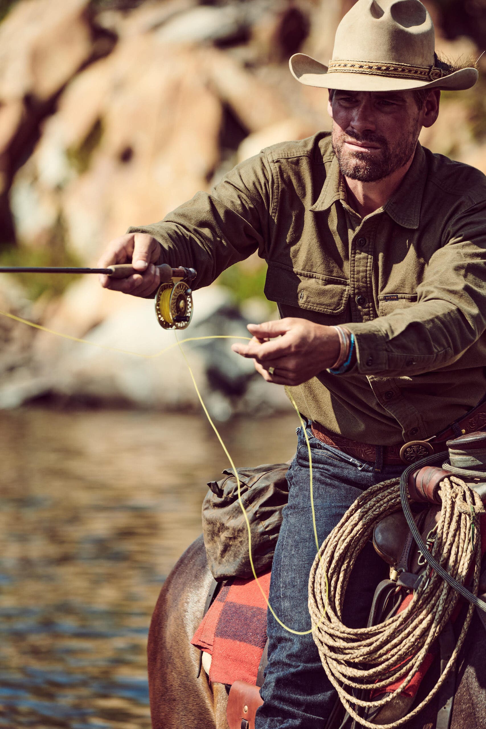 Trent Peterson fly fishing on horseback