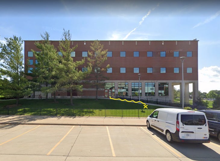 UNI business building with illustration of walking/falling path