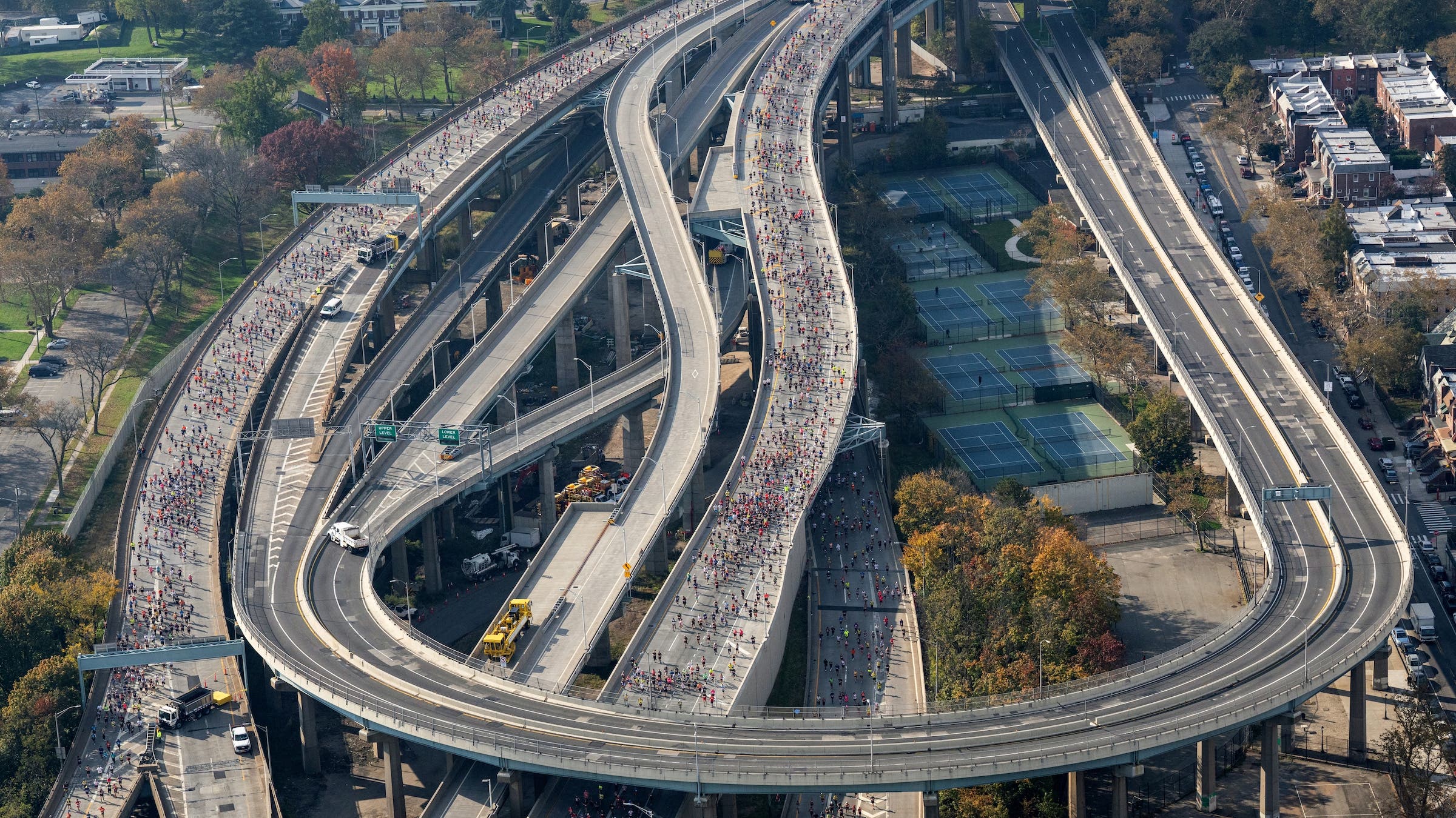 An aerial photo of a freeway tangle filled with runners