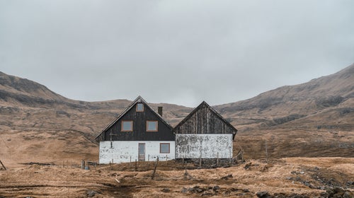 rural house against a cloudy sky