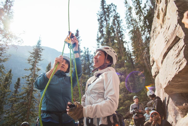 Eva Capozzola instructs Camille Santiago the finer points of rope ascension during the Arc'teryx High Angle Photography Clinic in Lake Louise, Alberta.