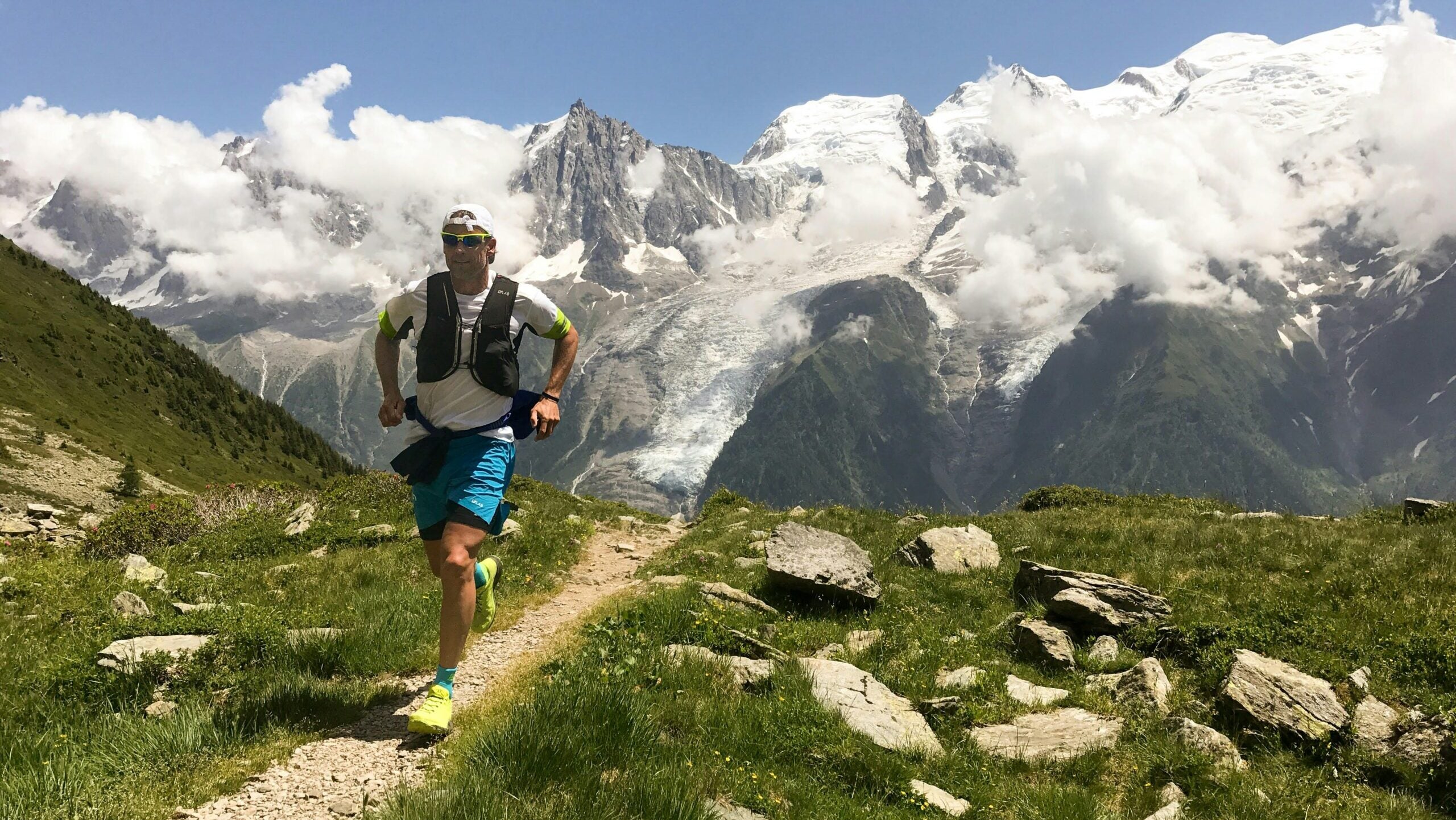 A runner runs on a high-altitude route in Chamonix, France.