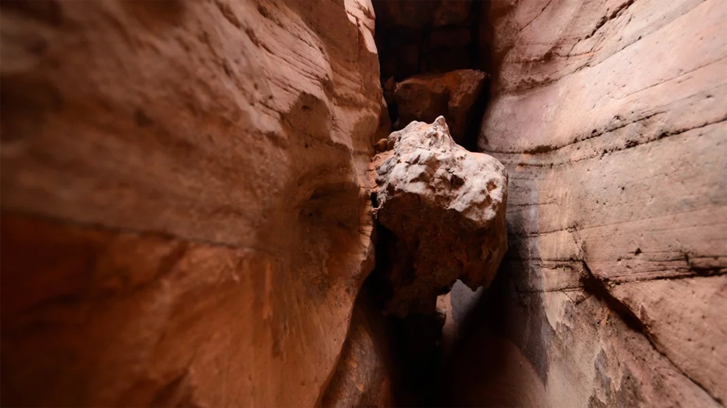 hiker under boulder trapped.