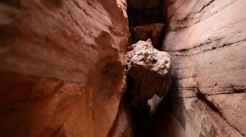 hiker under boulder trapped.