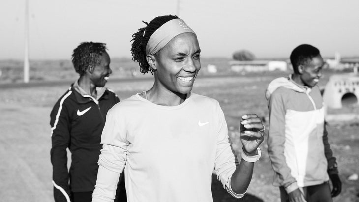 One women in white shirt is smiling during a workout