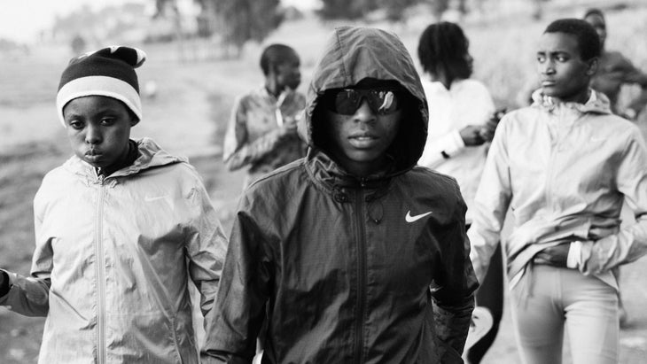 A group of women, one with a black hooded jacket on.