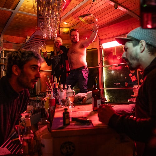 Caston (right) placing a drink order after the race