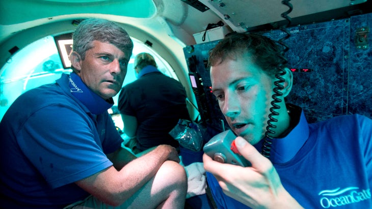 OceanGate CEO Stockton Rush, left, in one of his company's submersibles