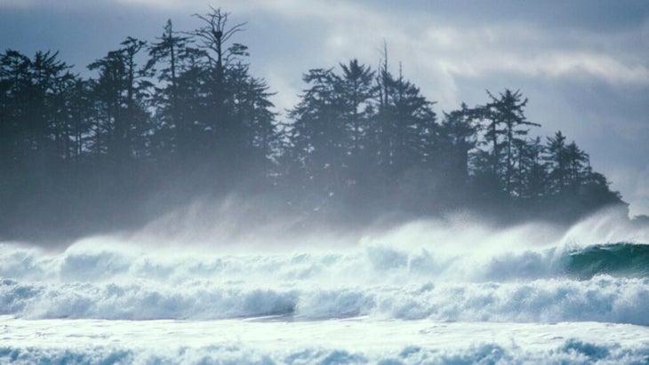 A set of ten-to-fifteen-foot waves crashing into the shores near Ucluelet