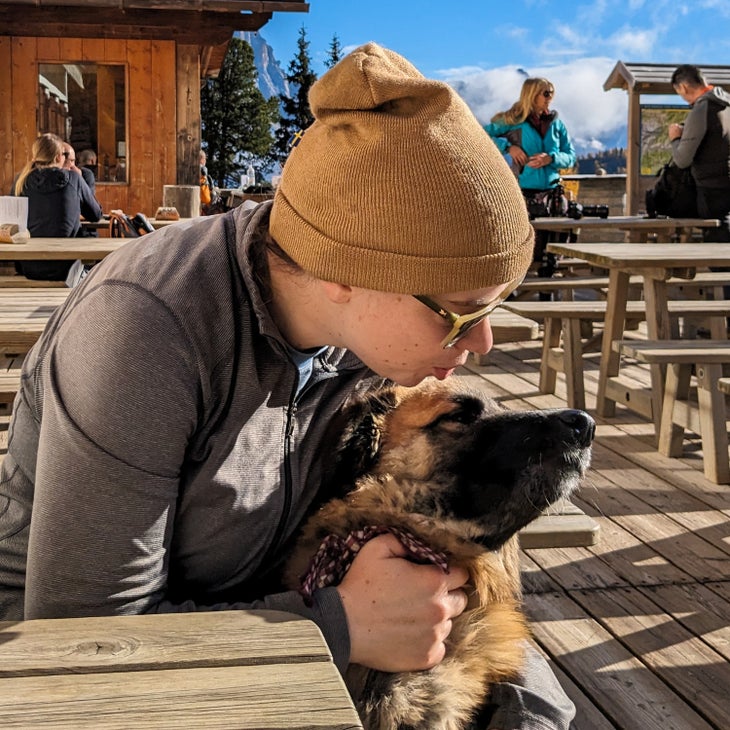 Mikaela Ruland and her dog at Rifugio Croda da Lago