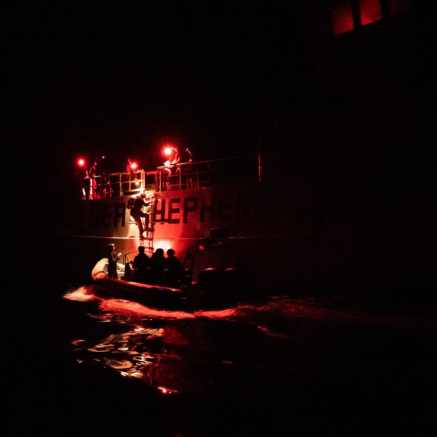 Robbie climbs down into Spitfire during a night patrol