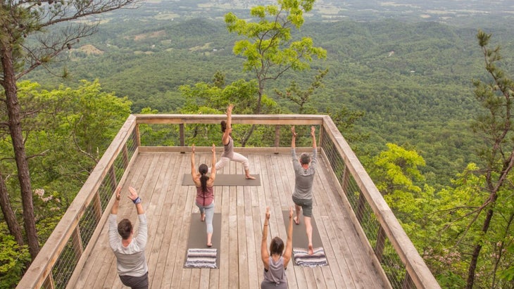 a yoga class on a deck at Blackberry Mountain wellness retreat in Tennessee