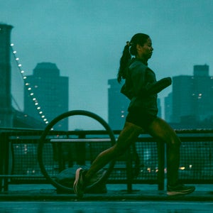 runner in Brooklyn dawn wearing Ciele PFAS-free waterproof running jacket
