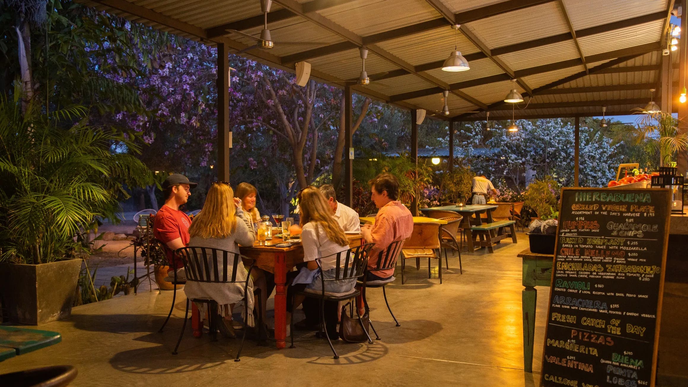 family eating dinner in Todos Santos at sunset