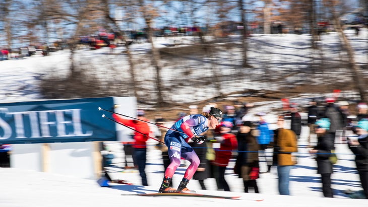 Skier Gus Schumacher speeds around a course.